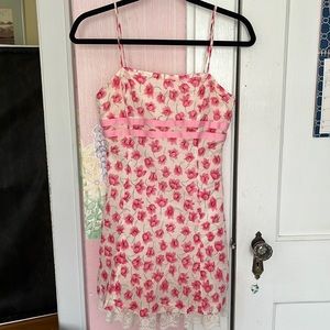 Pink floral dress with lace detail at hem